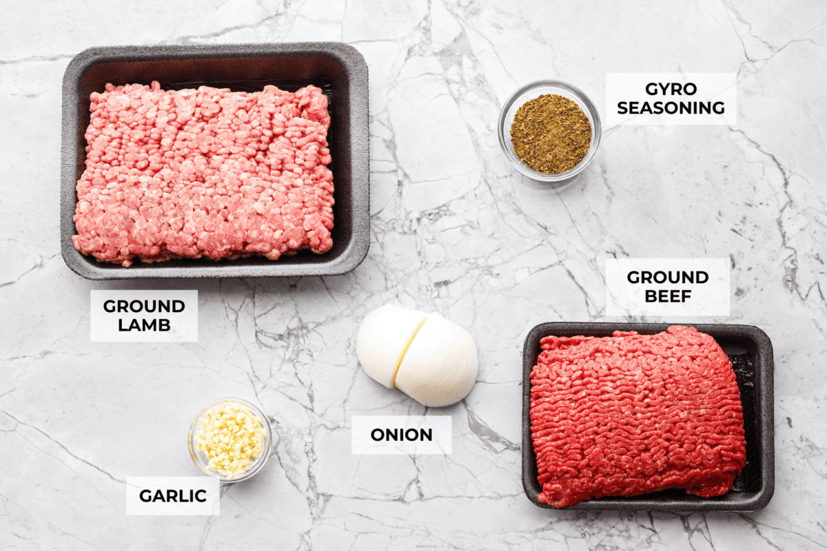 My easy-to-make gyro meat is perfectly seasoned and tender every time! Just like your favorite Mediterranean restaurant. Perfect for pitas, bowls, or platters with all your favorite toppings. Overhead shot of labeled gyro meat ingredients.