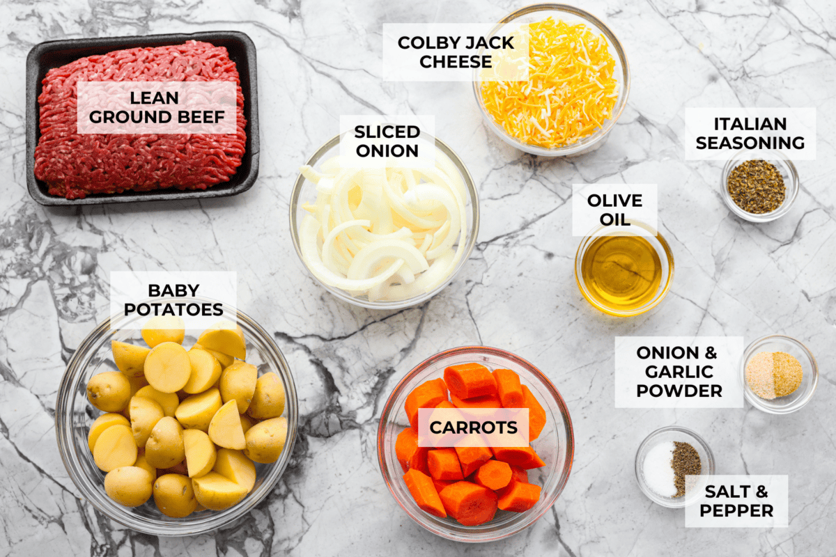 You know those nights when everyoneโs hungry and youโre one eye twitch away from serving cereal? My easy Hobo Dinner Foil Packets, packed with hearty veggies and juicy beef, are the answer! Overhead shot of labeled foil packet dinner ingredients.