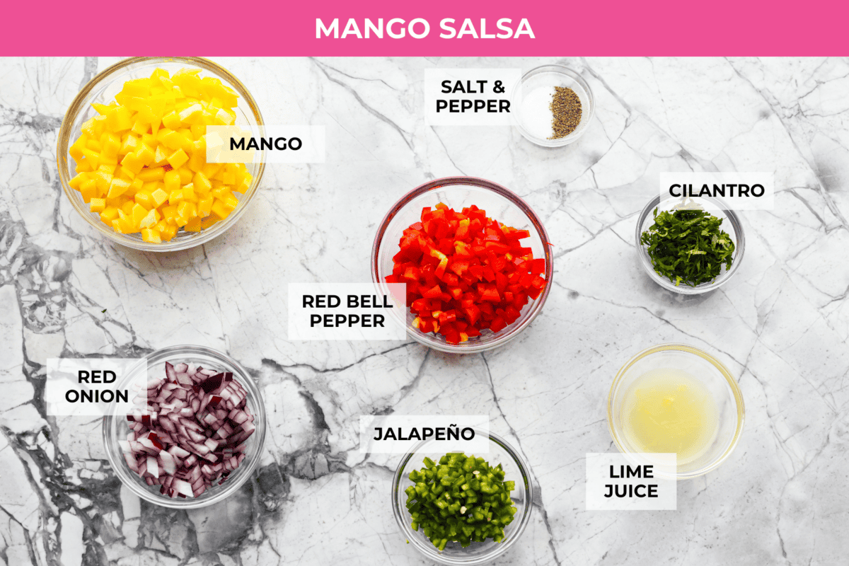 I'm obsessed with salmon, and this Mango Salsa Salmon might be my new favorite! Itโs quick, flavorful, and my kids will actually eat it! The fresh salsa is so good! Overhead shot of mango salsa ingredients.
