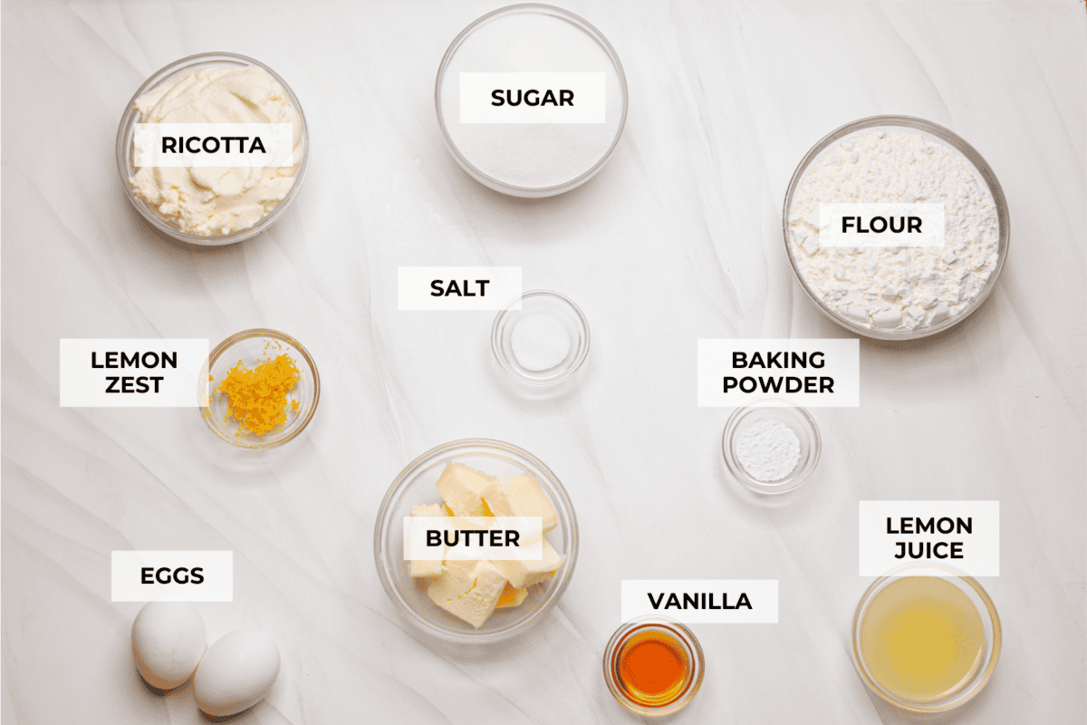 I used to make this with chocolate chips (RIP to that version), but after tasting this zesty lemon ricotta cake upgrade, I’m never looking back. Soft and rich from the ricotta, and that lemon? Chef’s kiss. Overhead shot of labeled lemon ricotta cake ingredients.