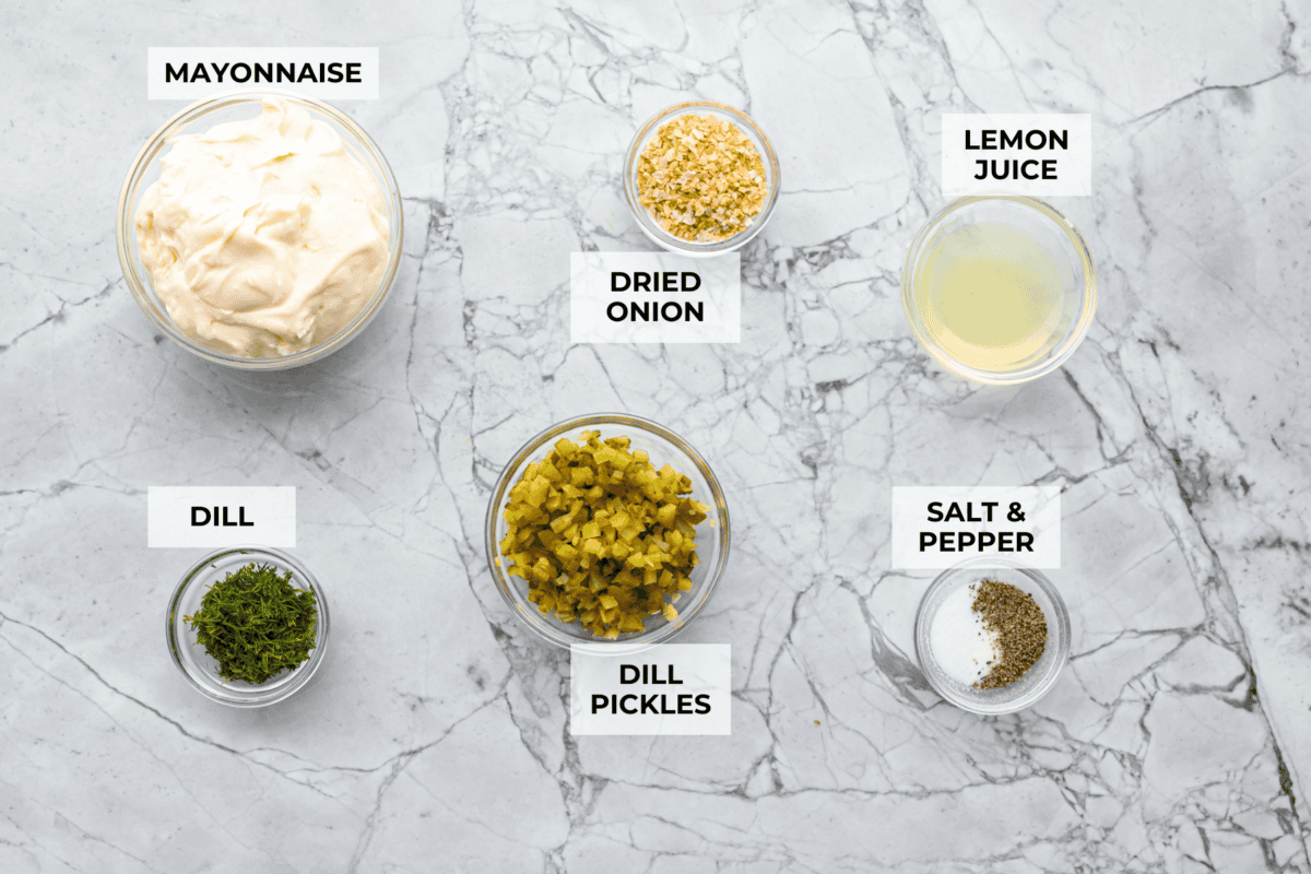 Tartar Sauce uses fresh herbs and my favorite, crunchy dill pickles. My recipe is unique because it uses dried onion, giving it the best punch of flavor and texture! Overhead shot of labeled ingredients.