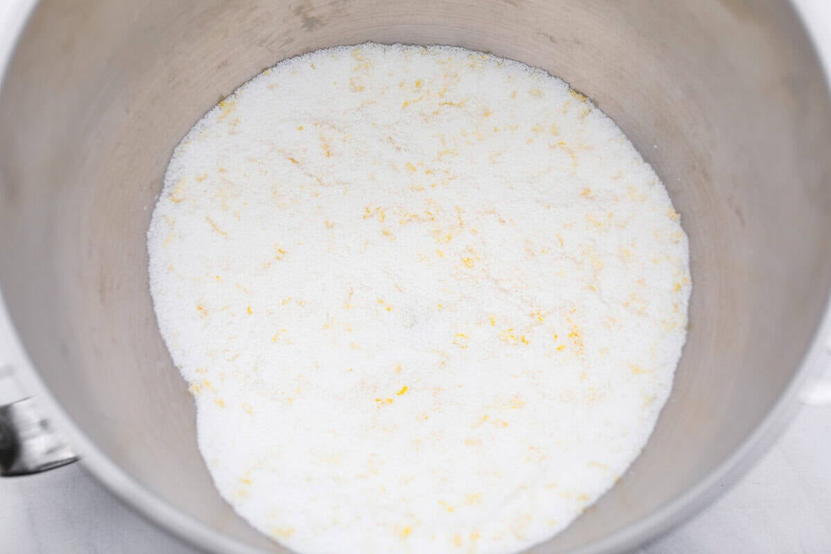 I used to make this with chocolate chips (RIP to that version), but after tasting this zesty lemon ricotta cake upgrade, I’m never looking back. Soft and rich from the ricotta, and that lemon? Chef’s kiss. Sugar mixed with lemon zest in a bowl.