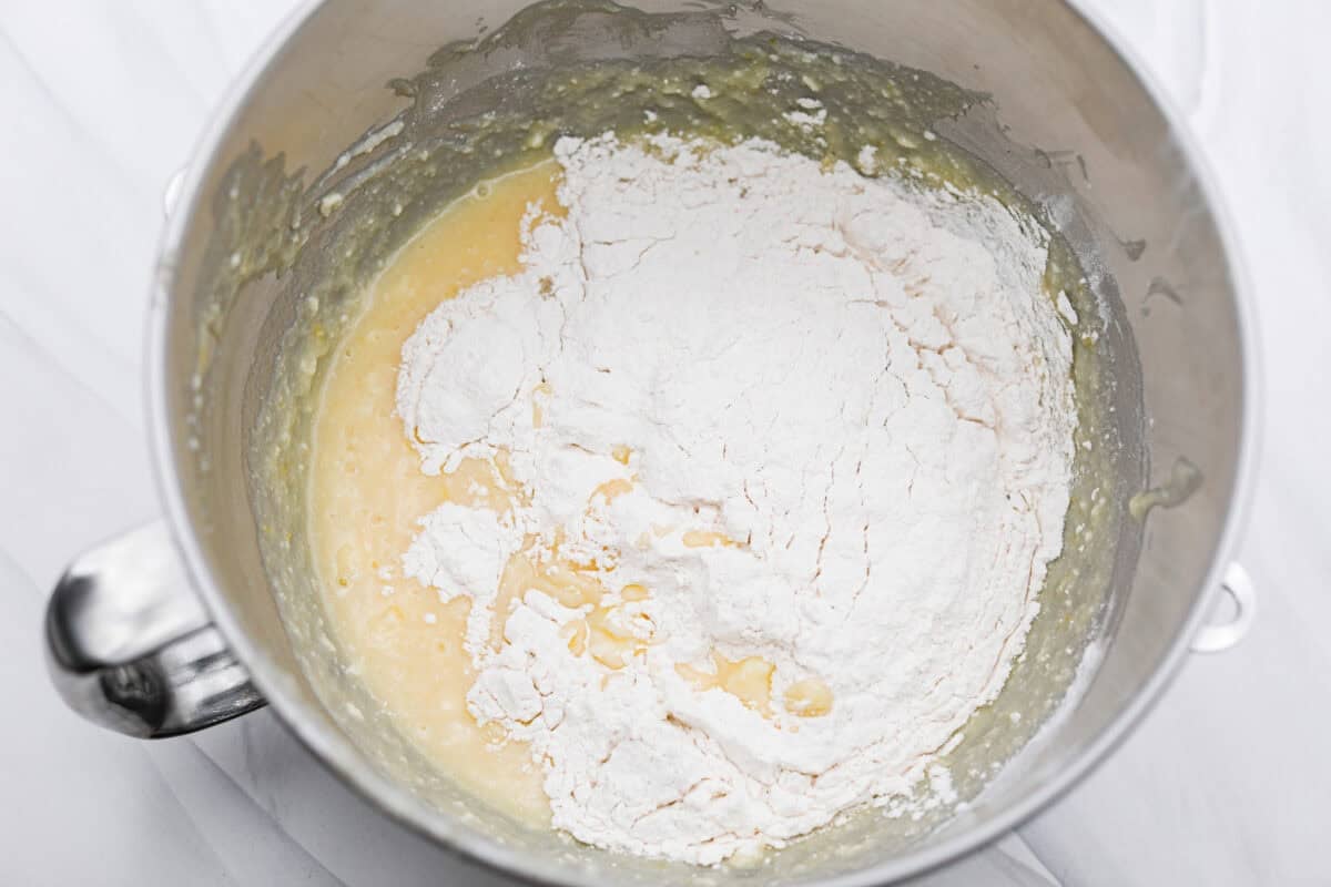 I used to make this with chocolate chips (RIP to that version), but after tasting this zesty lemon ricotta cake upgrade, I’m never looking back. Soft and rich from the ricotta, and that lemon? Chef’s kiss. Dry ingredients added to the wet ingredients in a stand mixing bowl.