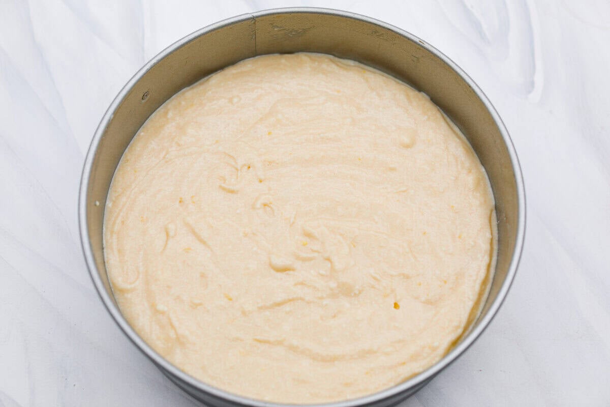 I used to make this with chocolate chips (RIP to that version), but after tasting this zesty lemon ricotta cake upgrade, I’m never looking back. Soft and rich from the ricotta, and that lemon? Chef’s kiss. Cake batter in a cake pan.