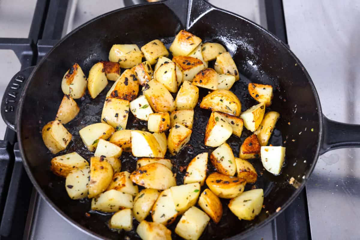 If there’s one dinner that never goes out of style, it’s steak and potatoes, especially when they’re seared to perfection in a hot skillet with garlic butter and fresh herbs. This one-pan meal is full of rich, savory flavor and comes together fast. Potatoes cooking in a skillet.