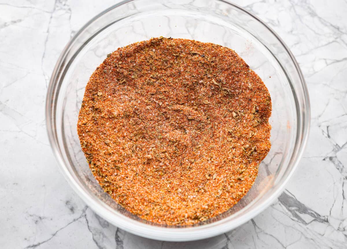 My kids always fight over who gets the chicken legs. With this Air Fryer Chicken Legs recipe, I can whip up a few batches and keep everyone happy! The bold flavor and crispy air-fried skin are totally unbeatable. Seasoning ingredients combined in a bowl.