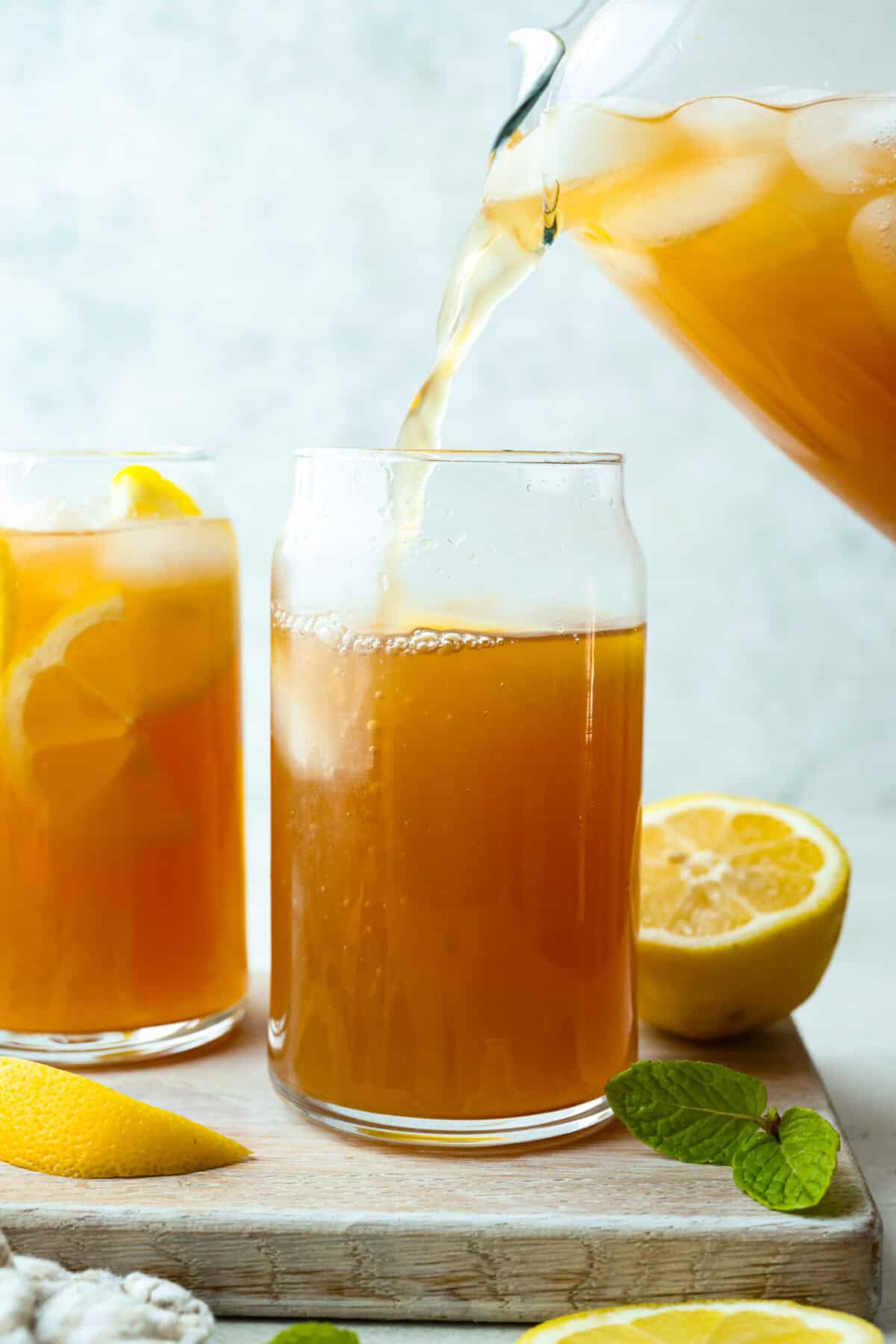 If you love iced tea, youโre going to be obsessed with this Arnold Palmer. The combo of crisp black tea and tangy lemonade is pure summer magic. Itโs simple, refreshing, and always just what you need. Someone pouring Arnold Palmer mix into a tall glass with ice and lemon slices.