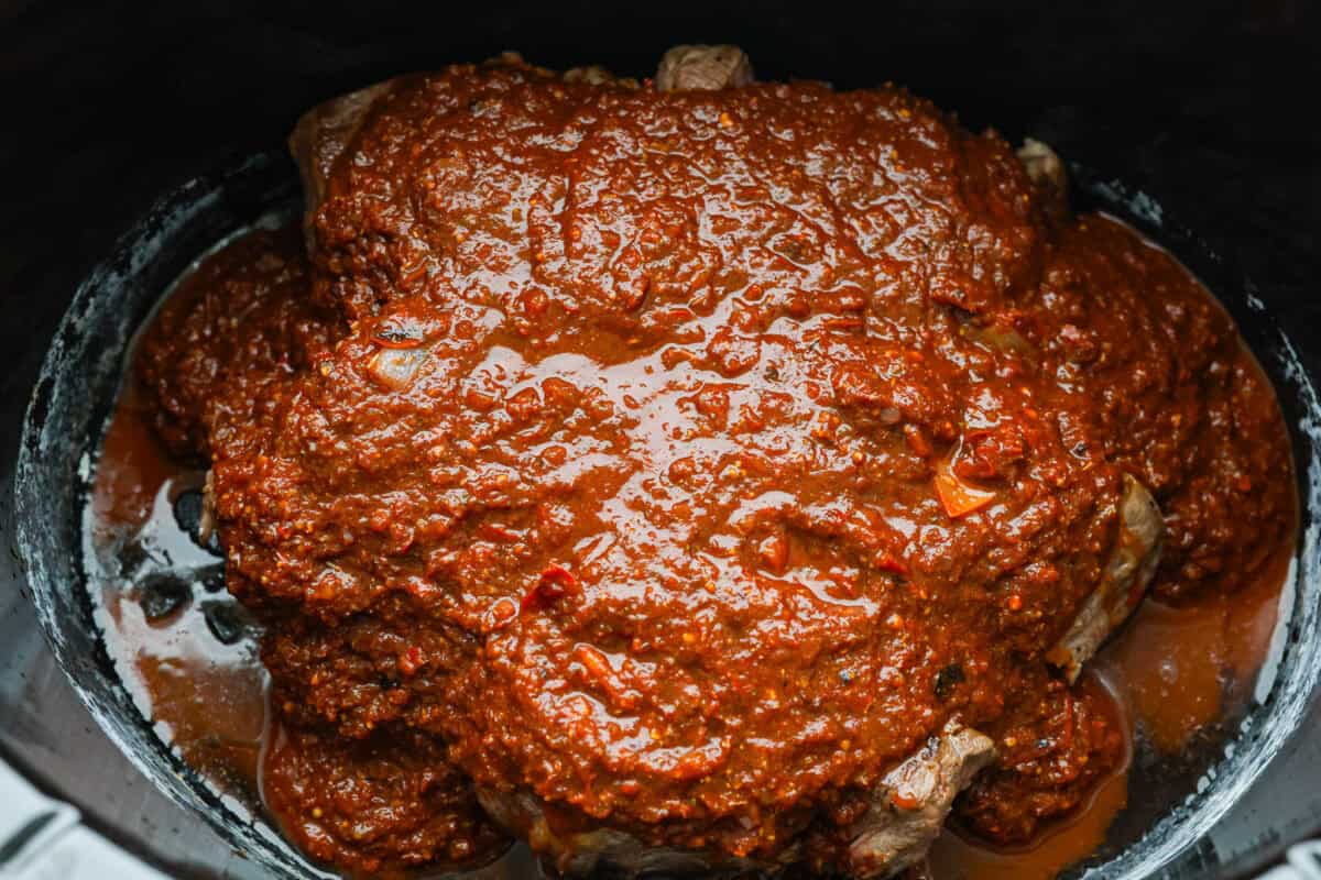 My Birria Ramen is next-level delicious! Tender shredded chuck roast, rich consommé, and slurp-worthy noodles all in one bowl. Birria consume on top of the beef in the crock pot.