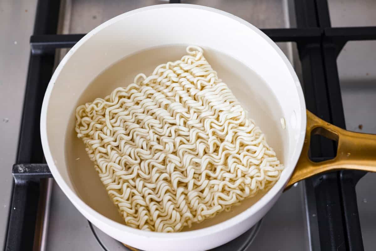 My Birria Ramen is next-level delicious! Tender shredded chuck roast, rich consommé, and slurp-worthy noodles all in one bowl. Ramen noodles being cooked in boiling water.