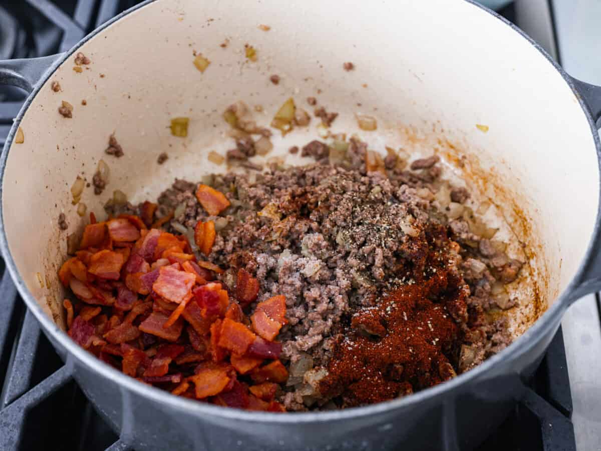 Every time I bring these cowboy beans to a summer BBQ, people start begging for the recipe, and honestly, I donโt blame them. Theyโre hearty, a little smoky, a little sweet, and always the first thing to disappear. Cooked ground beef with bacon and seasonings added in.