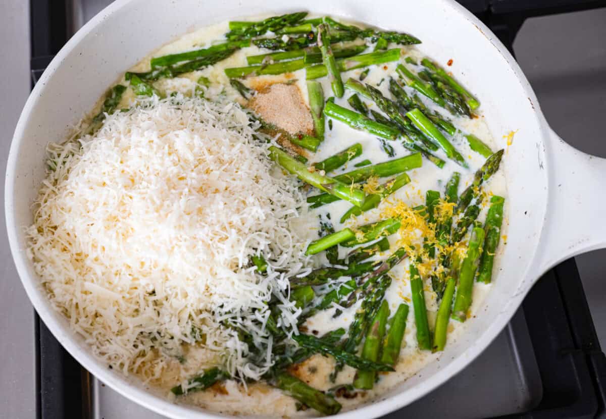 My Lemon Garlic Chicken Asparagus Pasta looks like something youโd order at a fancy bistro, but it literally takes 30 minutes! Itโs zesty, garlicky, and seriously so good! Sauce ingredients added to the asparagus, butter and garlic.
