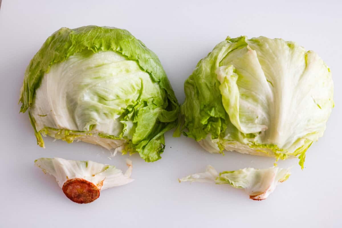 This classic wedge salad brings all the steakhouse vibes! Piled high with crispy bacon, fresh tomatoes, and a drizzle of creamy blue cheese dressing, it's a simple side that goes with just about anything. Ends of lettuce cut off.