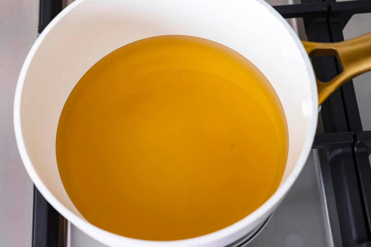 My pickled carrots and daikon are the zesty upgrade your meals didn’t know they needed! Made with rice vinegar, they’re a little sweeter and less sharp than typical pickled veggies. Brine ingredients in a pot on the stove.