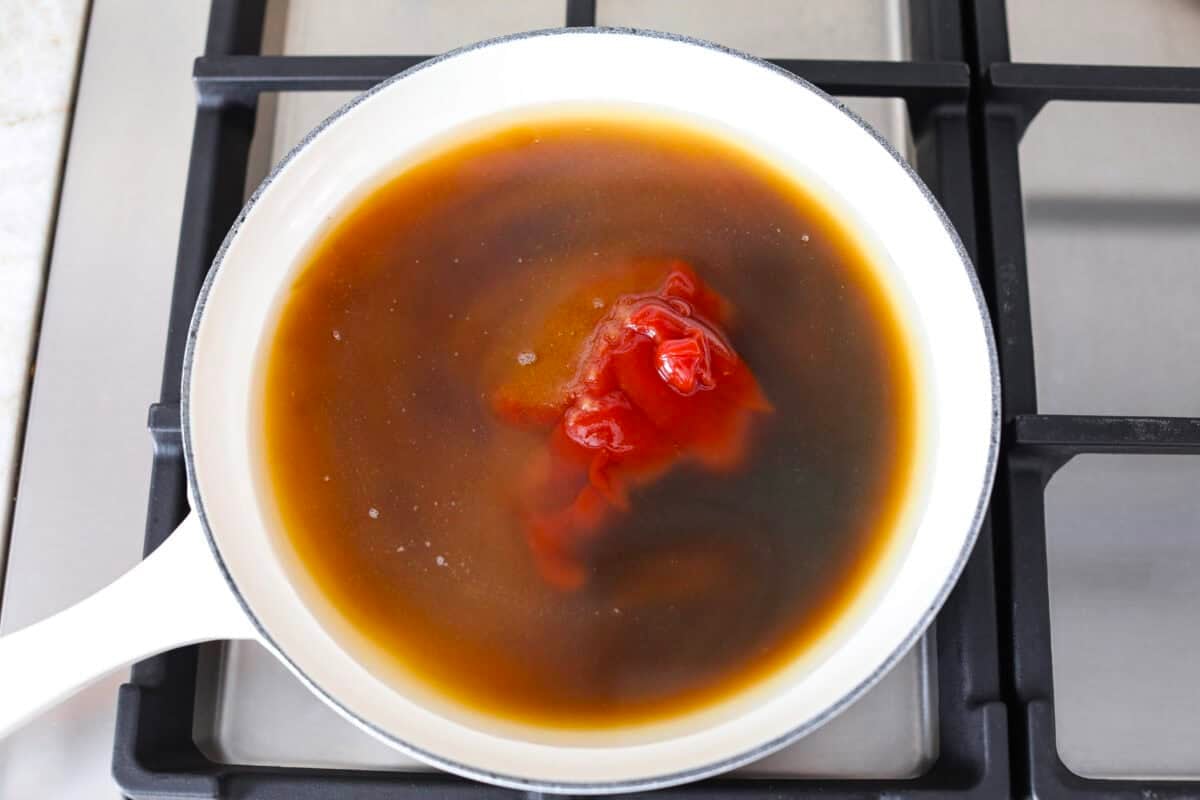 Iโve tested a lot of sweet and sour sauces, and this is the one I always come back to. My recipe uses pineapple juice for that perfect tangy-sweet balance, and itโs ready in minutes with pantry staples. All of the ingredients added to a pan on the stove.