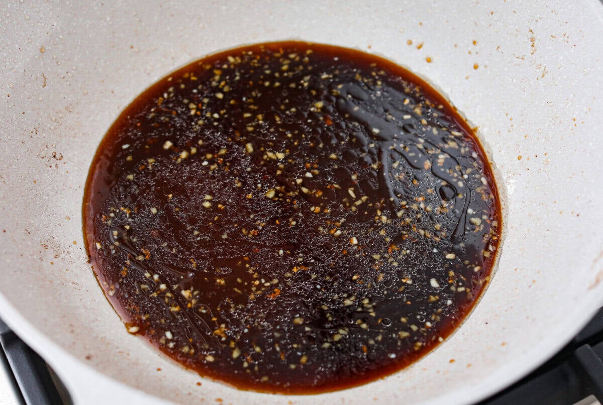 My family is obsessed with my better-than-takeout Beef Teriyaki. The secret? Velveting the beef! It’s simple, but it makes it unbelievably tender. Trust me, you’ll want this trick in your back pocket. Sauce mixture cooking in a pan.