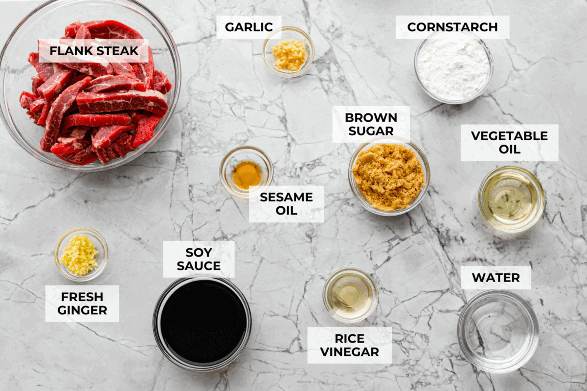 My family is obsessed with my better-than-takeout Beef Teriyaki. The secret? Velveting the beef! It’s simple, but it makes it unbelievably tender. Trust me, you’ll want this trick in your back pocket. Overhead shot of labeled beef teriyaki ingredients.