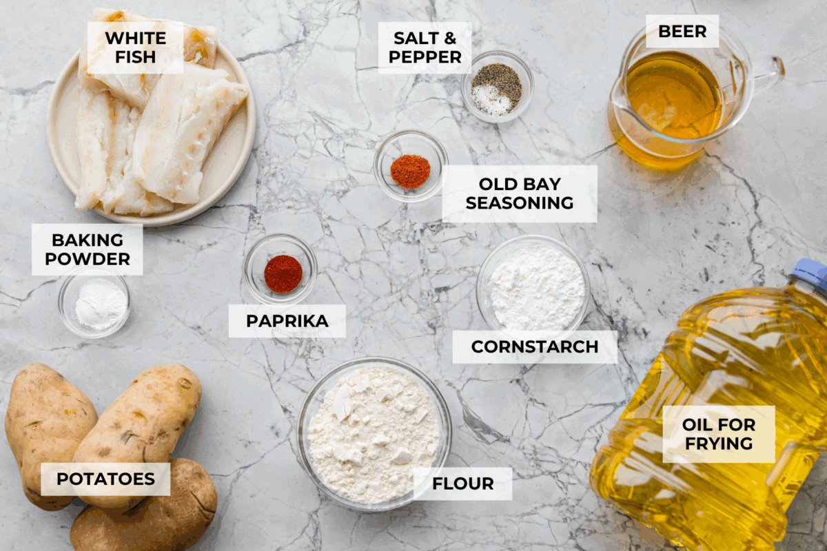 Skip the overpriced takeout and bring the pub vibes home! Crispy, golden fish and chips—light, flaky, pan-fried perfection. It’s cheaper, easier, and honestly? Way better than anything stuffed in a greasy paper bag. Overhead shot of labeled ingredients.