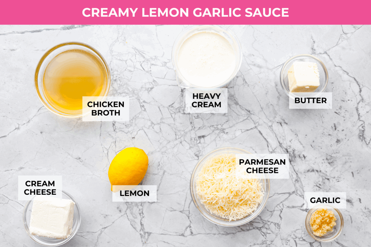 My seafood pasta has a silky lemon garlic cream sauce that is to die for! It's loaded with tender shrimp, scallops, and mussels. Itโs the perfect date night dish! Overhead shot of labeled sauce ingredients.