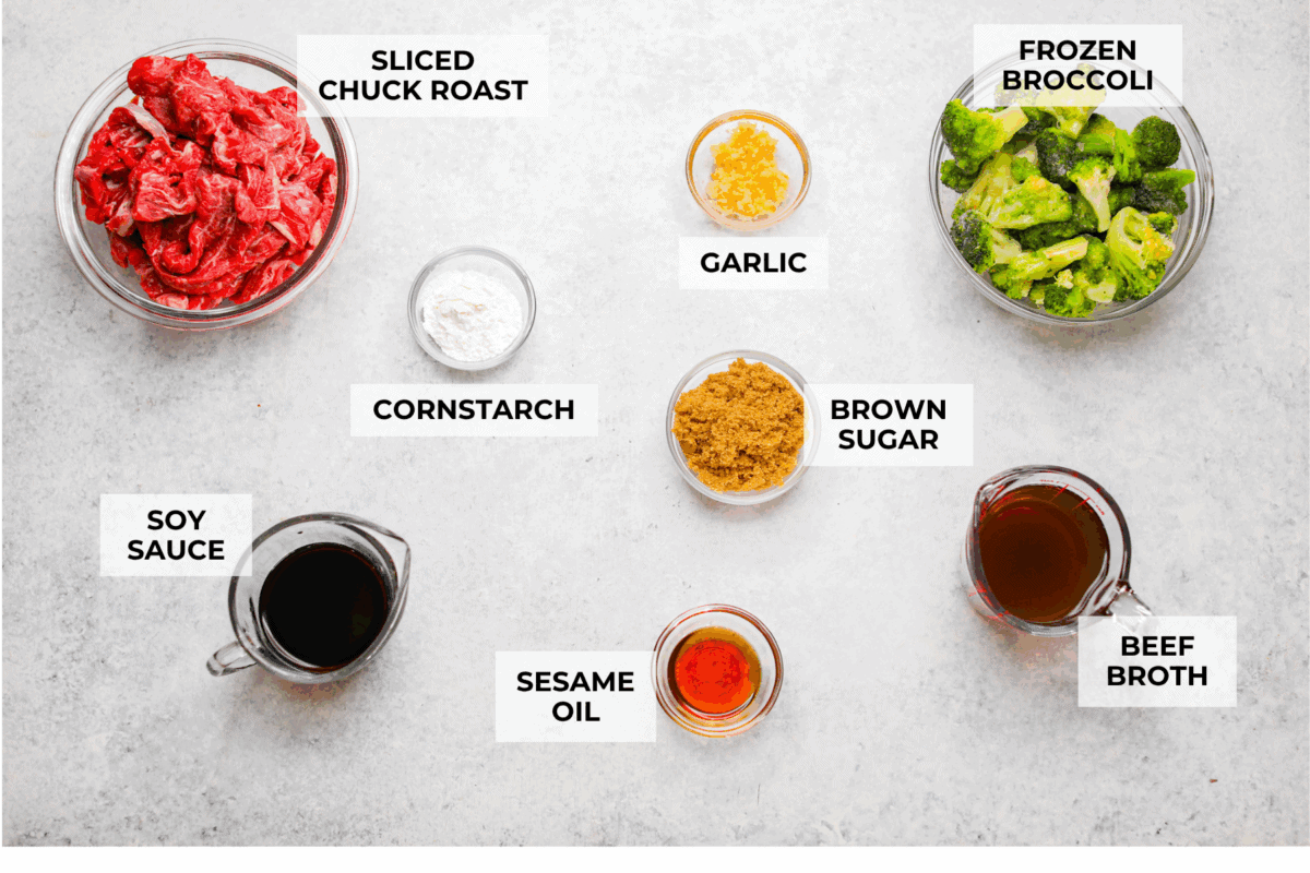 This beef and broccoli takes just minutes to toss in the slow cooker, and itโs hands-down one of my top recipes on the site! The beef turns melt-in-your-mouth tender, and the flavor is totally next level! Overhead shot of labeled ingredients.
