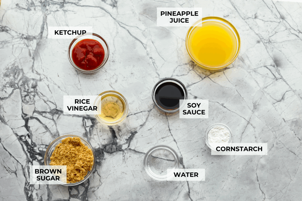 Iโve tested a lot of sweet and sour sauces, and this is the one I always come back to. My recipe uses pineapple juice for that perfect tangy-sweet balance, and itโs ready in minutes with pantry staples. Overhead shot of labeled sweet and sour sauce ingredients.