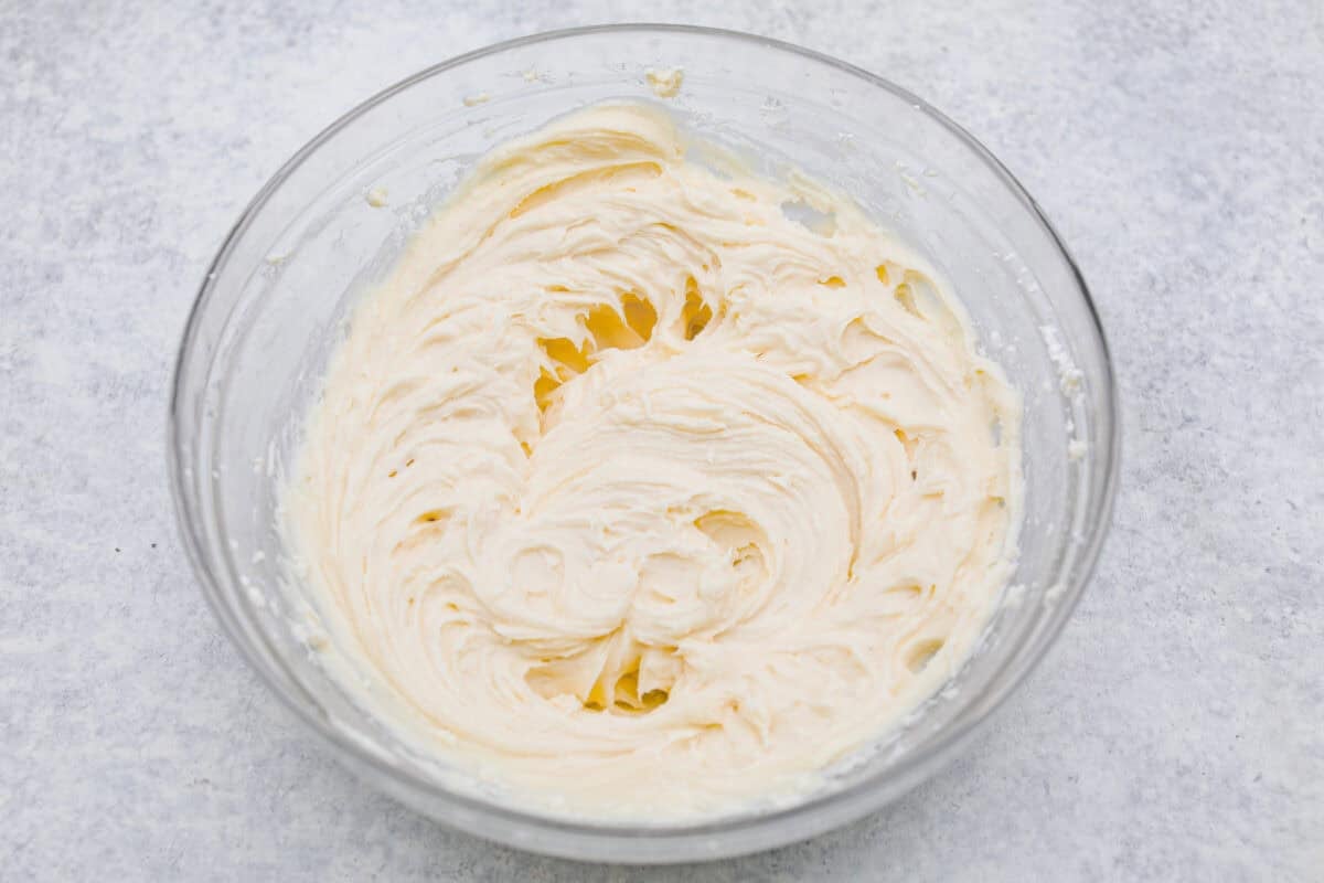 Craving a bright and sunny dessert? This pineapple delight will hit the spot! With a buttery crust, creamy filling, and sweet pineapple topping, it’s light, tropical, and totally irresistible! Sugar and vanilla added to the cream cheese and butter.
