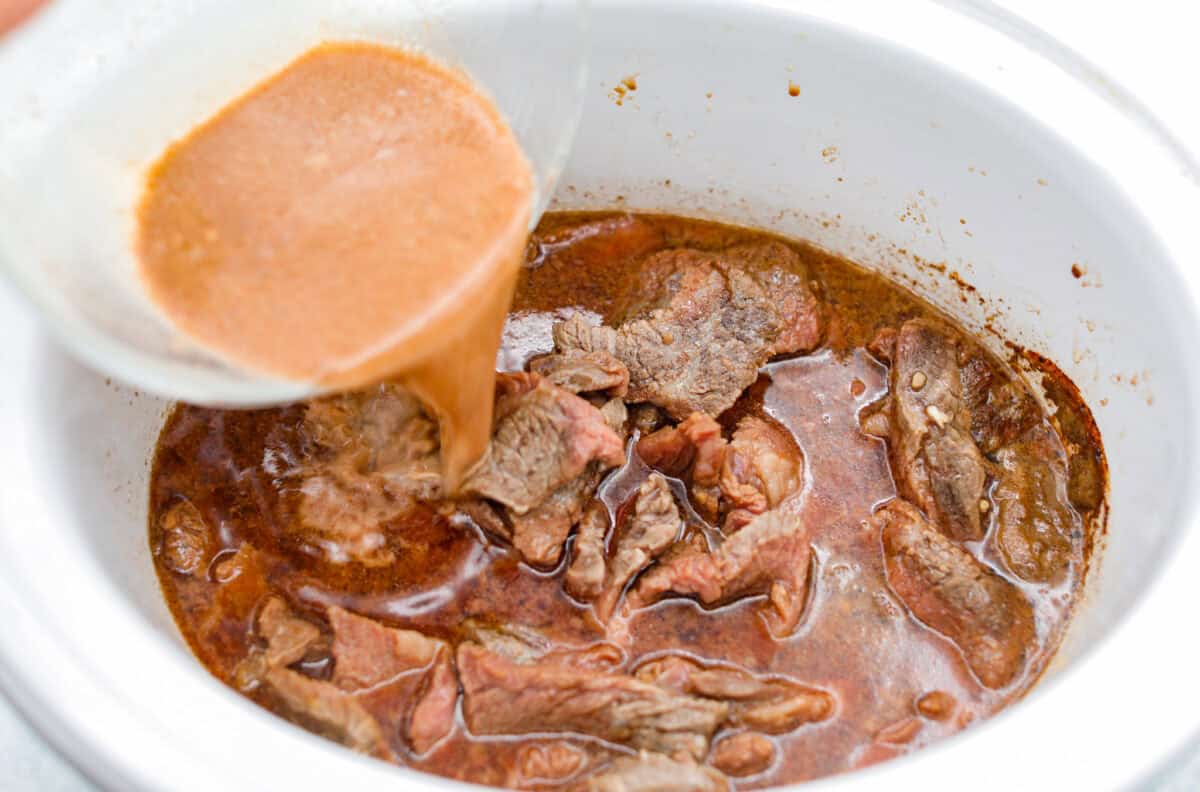 This beef and broccoli takes just minutes to toss in the slow cooker, and itโs hands-down one of my top recipes on the site! The beef turns melt-in-your-mouth tender, and the flavor is totally next level! Cornstarch and some of the sauce being added back to the crockpot.