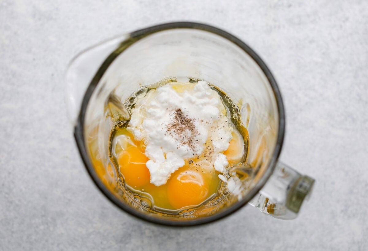 Iโve been hooked on Starbucks egg bites for years, but not the price! This homemade version is just as fluffy and flavorful, and makes the perfect grab-and-go, protein-packed breakfast. Eggs, cottage cheese, and seasonings in a blender.