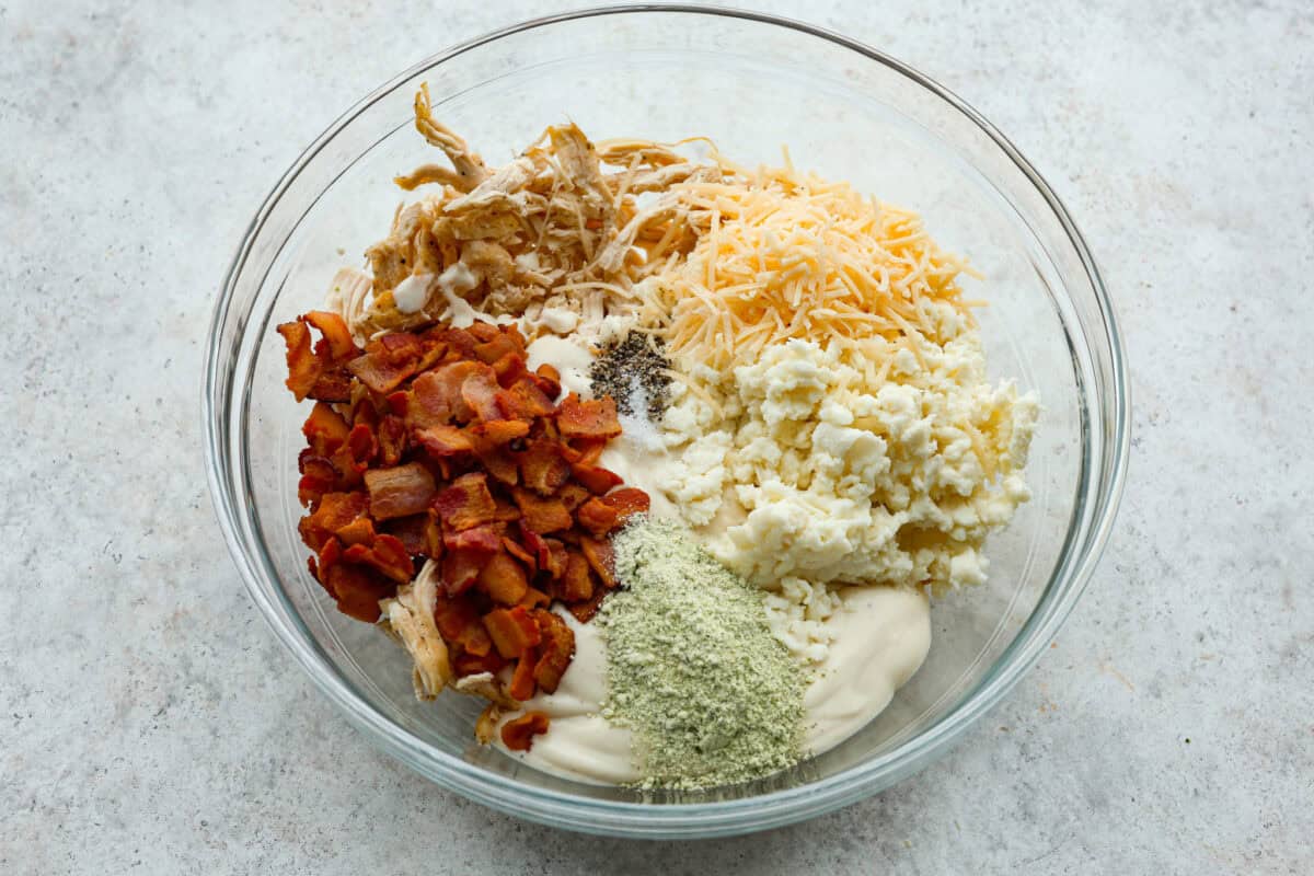 Want to make something you know your kids will eat? This chicken bacon ranch casserole is it! I can't tell you how delicious this casserole is! The combination of flavors is perfection! You have to try it! Casserole ingredients in a large mixing bowl.
