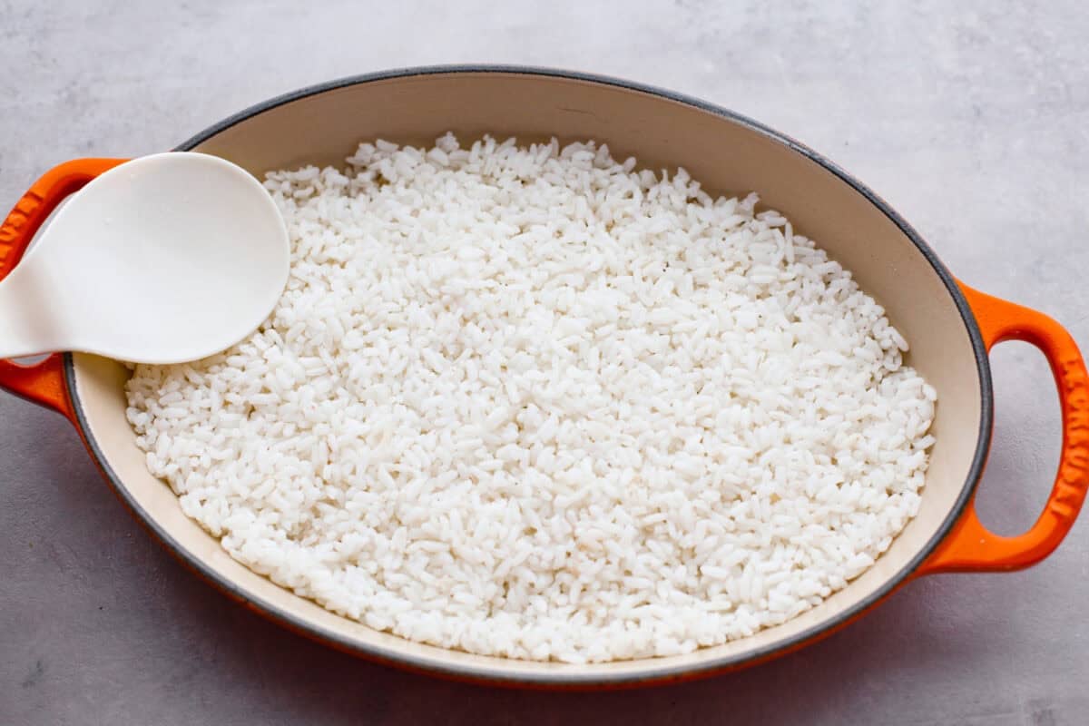 My simple Sushi Bake has all the flavors you love about sushi in an easy, no-roll casserole-style dish. Itโs faster, more affordable, and perfect for feeding a crowd without sacrificing that sushi fix. Cooked and seasoned rice pressed into the bottom of a baking dish.