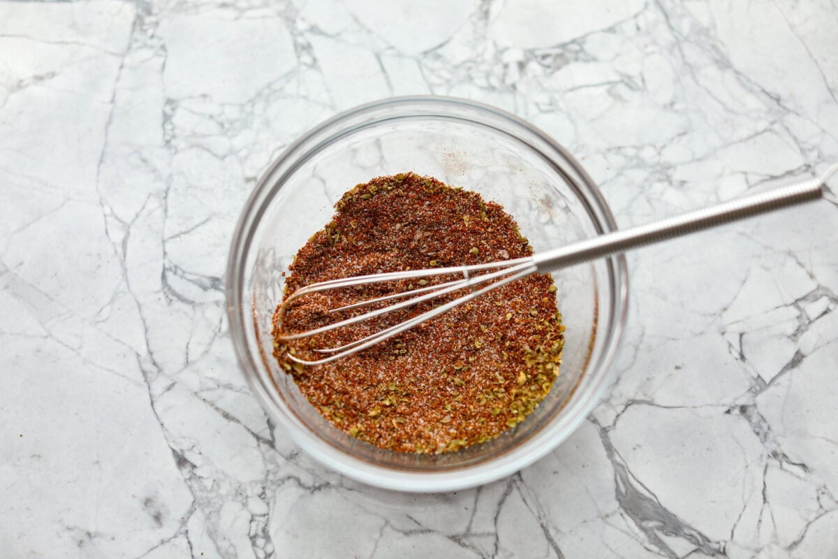 Okay, this homemade fajita seasoning is seriously next-level. I mix it up with pantry spices I always have on hand, and it makes everything taste better! Chicken, steak, veggies, you name it. Bowl of ingredients mixed together.