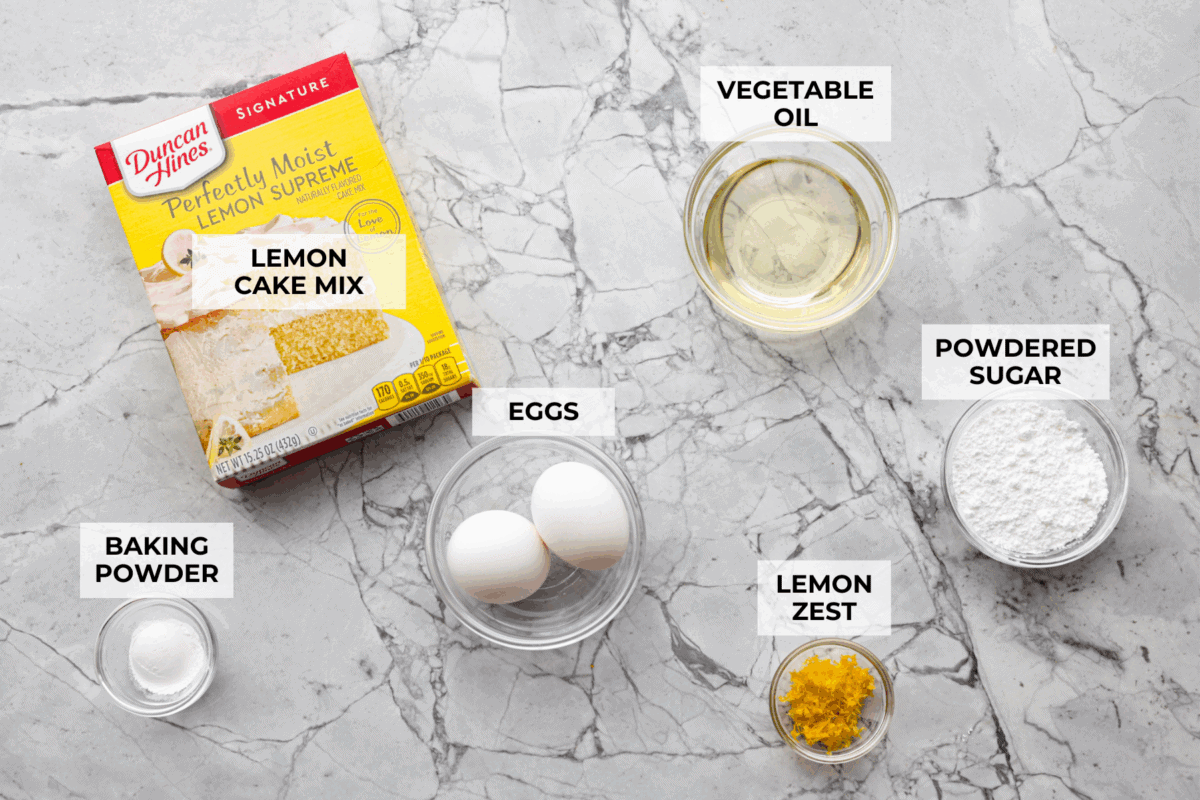 My Lemon Cake Mix Cookies are the shortcut your sweet tooth has been waiting for. Using a cake mix means you can enjoy soft, lemony cookies with a bakery-style texture in a fraction of the time. Overhead shot of labeled ingredients.