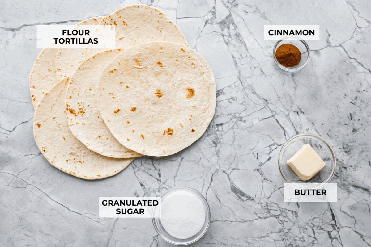 You have to try these cinnamon sugar tortilla chips! They're sweet, crispy, and totally addictive. They’re perfect for scooping up your favorite dessert dips or gobbling them down on their own! Overhead shot of labeled ingredients.