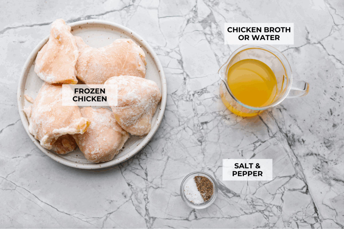 Forgot to thaw the chicken? No problem! This instant pot frozen chicken recipe turns rock-solid breasts into tender, juicy perfection in no time. Dinner crisis averted! Overhead shot of labeled ingredients.