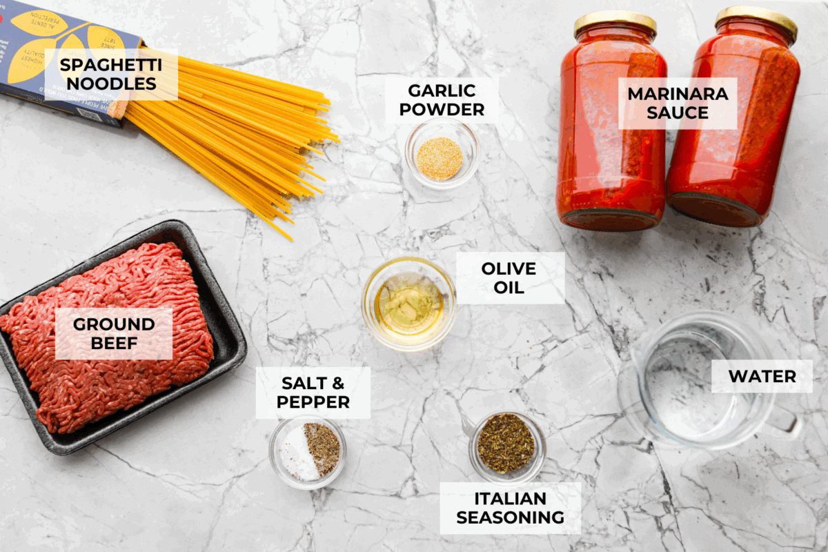 When dinner needs to happen fast, instant pot spaghetti is your new best friend! Perfectly seasoned beef, tender pasta, and a rich, saucy finish, all in one pot and ready in less than 15 minutes. Overhead shot of labeled ingredients.