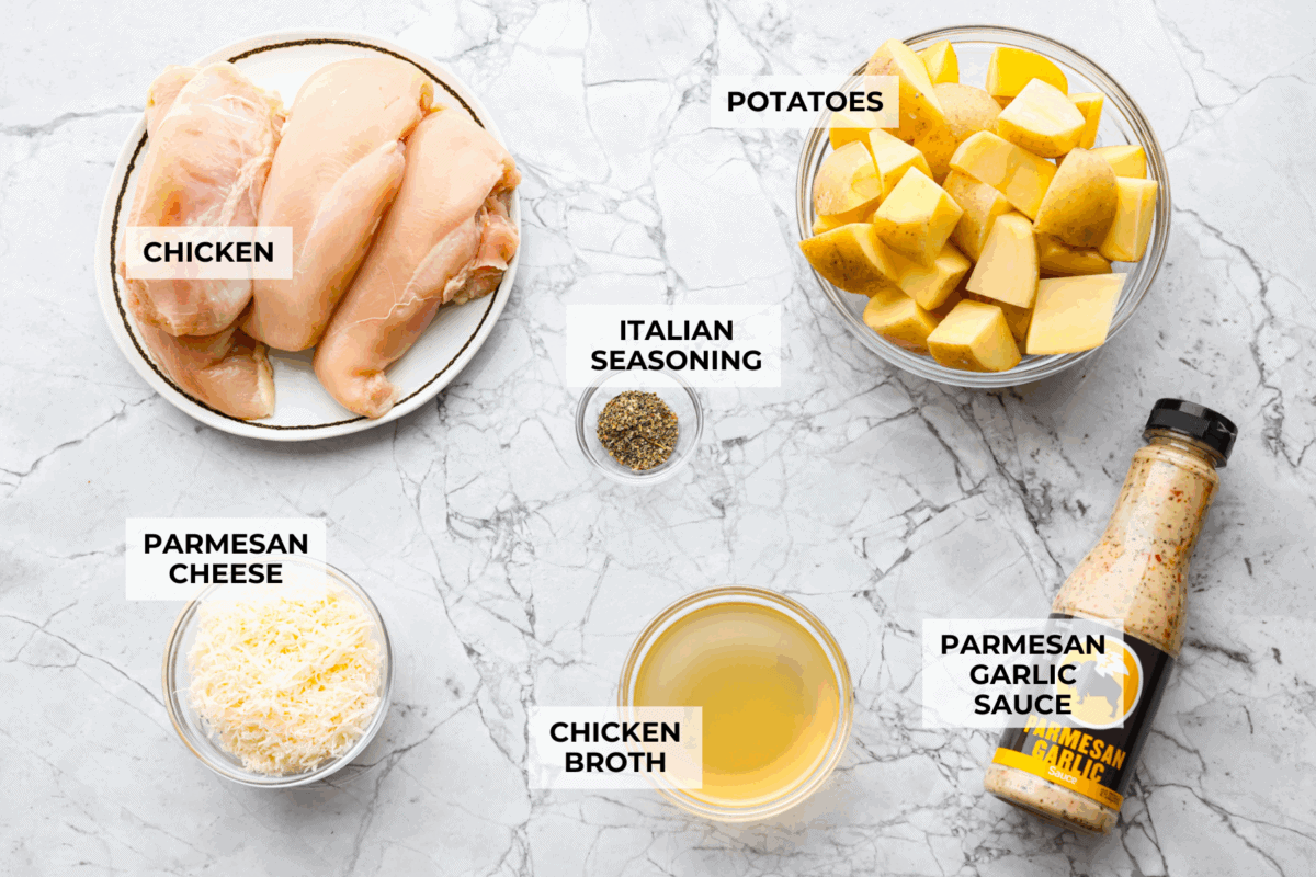 This viral slow cooker Parmesan garlic chicken has juicy meat, tender potatoes, and a sauce so rich and creamy that scooping it with a spoon wonโt cut it. Youโll want to drink it, or letโs be real, bathe in it. Overhead shot of labeled ingredients.