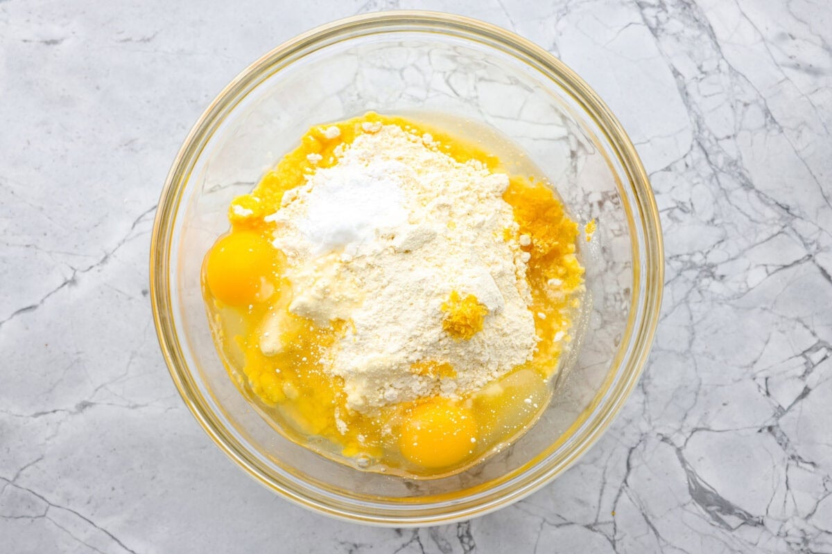 My Lemon Cake Mix Cookies are the shortcut your sweet tooth has been waiting for. Using a cake mix means you can enjoy soft, lemony cookies with a bakery-style texture in a fraction of the time. Bowl of eggs, cake mix, baking powder, vegetable oil and lemon zest.
