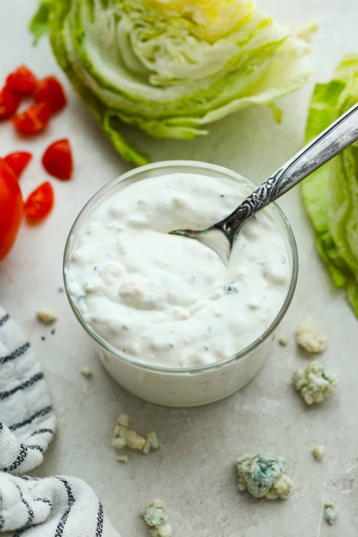 Overhead shot of a small jar of homemade blue cheese dressing.