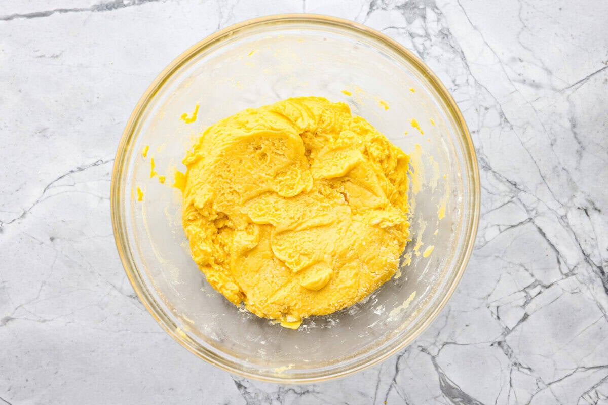 My Lemon Cake Mix Cookies are the shortcut your sweet tooth has been waiting for. Using a cake mix means you can enjoy soft, lemony cookies with a bakery-style texture in a fraction of the time. All of the ingredients mixed together in a bowl.