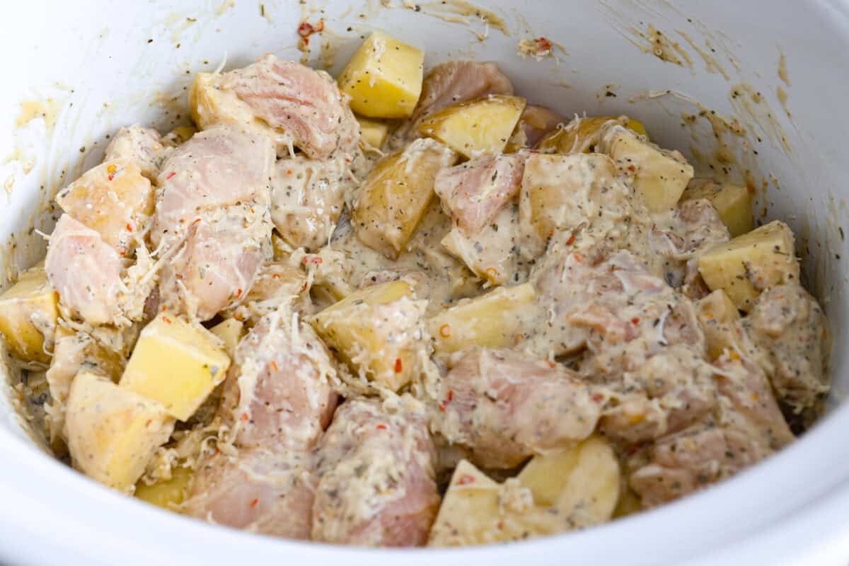 This viral slow cooker Parmesan garlic chicken has juicy meat, tender potatoes, and a sauce so rich and creamy that scooping it with a spoon wonโt cut it. Youโll want to drink it, or letโs be real, bathe in it. All of the ingredients mixed together in the crockpot.