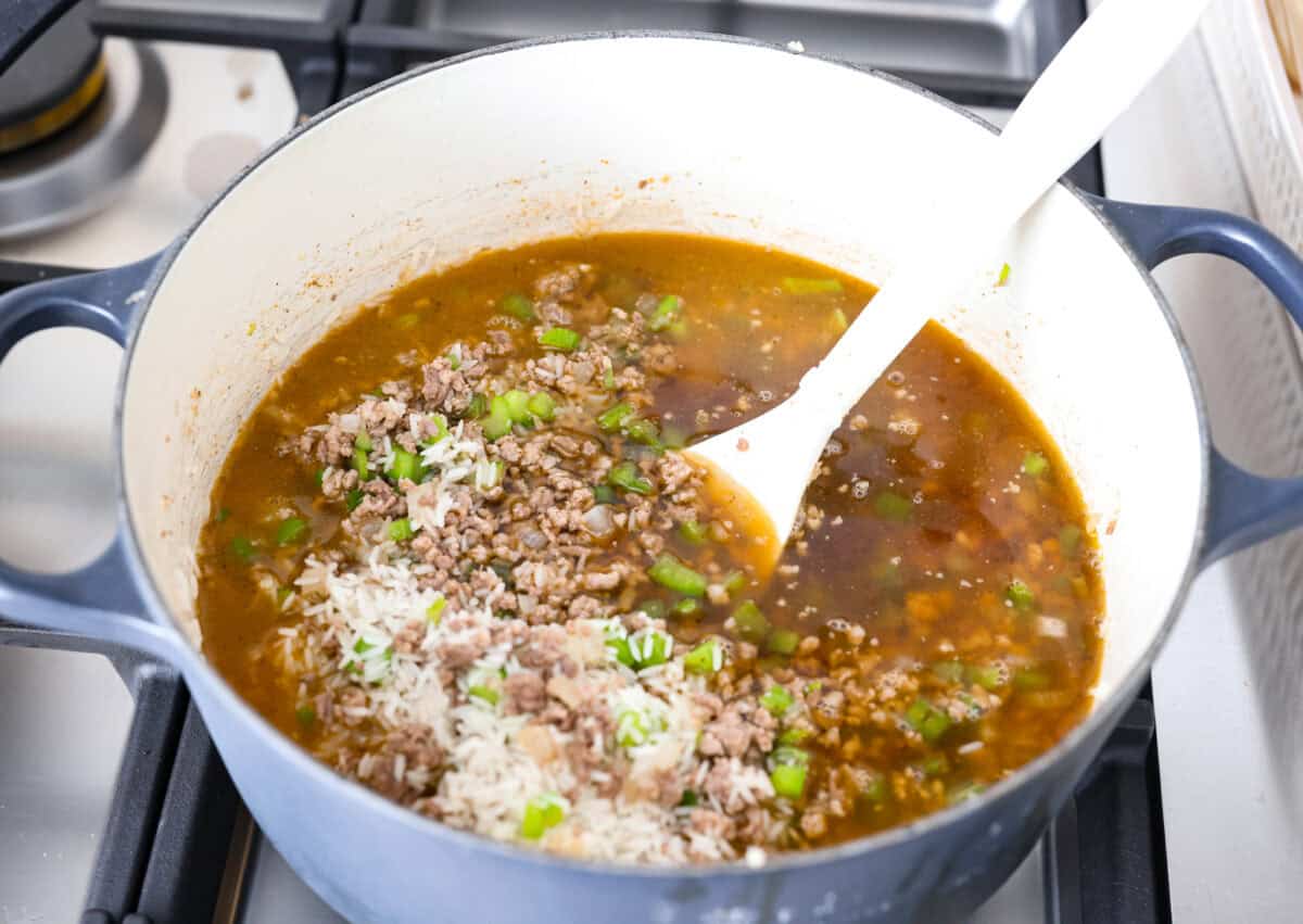 Why is it called โdirtyโ rice? The rice gets brown as it cooks with meat, Cajun spices, and the holy trinity of Cajun cooking: onion, bell pepper, and celery. My version combines ground pork and beef for a flavorful twist on this Louisiana classic! Broth and rice added to the meat and veggie mixture.