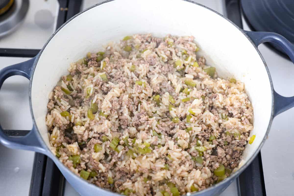 Why is it called โdirtyโ rice? The rice gets brown as it cooks with meat, Cajun spices, and the holy trinity of Cajun cooking: onion, bell pepper, and celery. My version combines ground pork and beef for a flavorful twist on this Louisiana classic! Dirty rice all cooked and fluffed ready to be served.