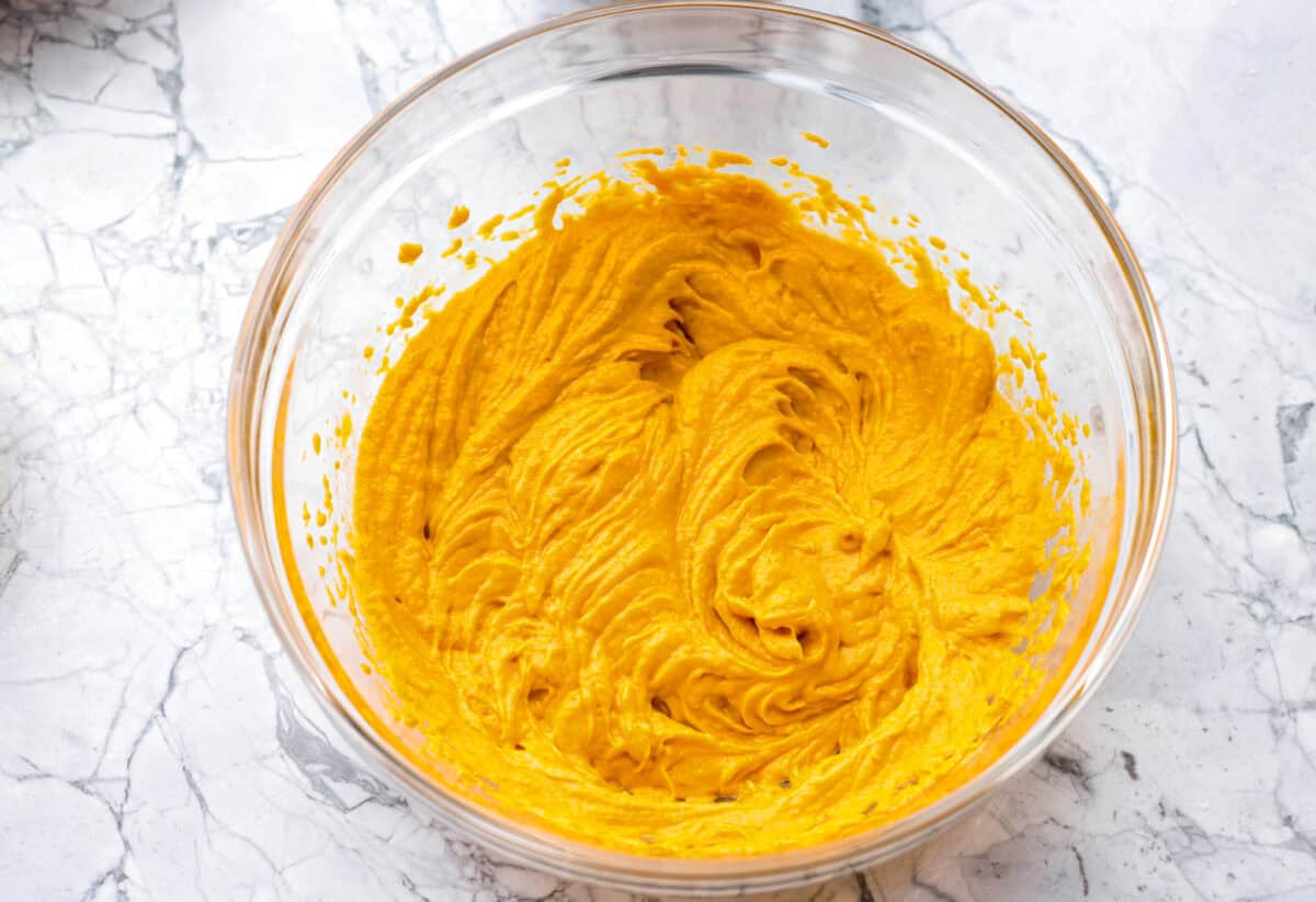 Get ready to spoil your furry friend! These homemade dog treats are made with simple ingredients and come together in no time. Your pup won’t stop begging for more! Bowl of peanut butter, pumpkin, and eggs mixed together.