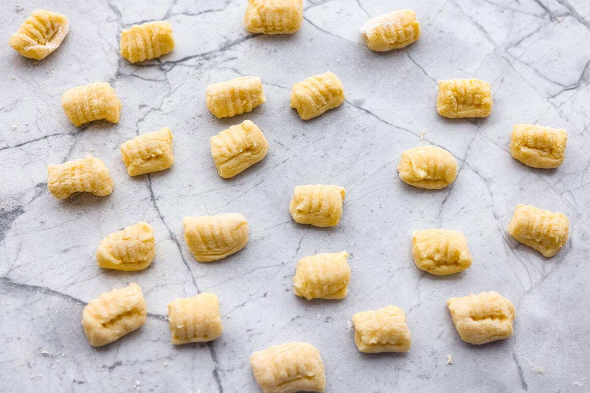Homemade potato gnocchi is easier than you think! With just 5 simple ingredients, you can make soft, pillowy gnocchi at home. I’ll walk you through each step with clear instructions so you can master this classic Italian recipe on your first try. Bite sized pieces of homemade potato gnocchi dough.
