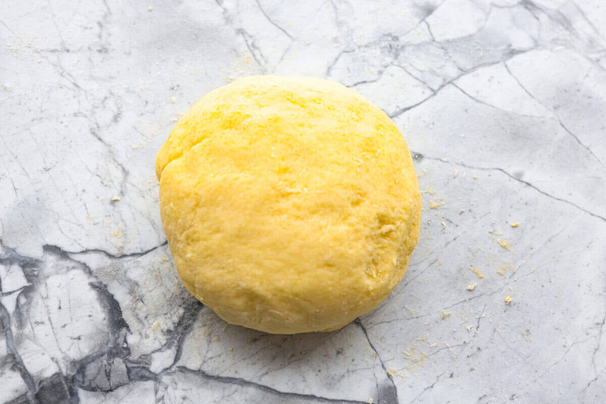Homemade potato gnocchi is easier than you think! With just 5 simple ingredients, you can make soft, pillowy gnocchi at home. I’ll walk you through each step with clear instructions so you can master this classic Italian recipe on your first try. Ball of dough ready to rest.