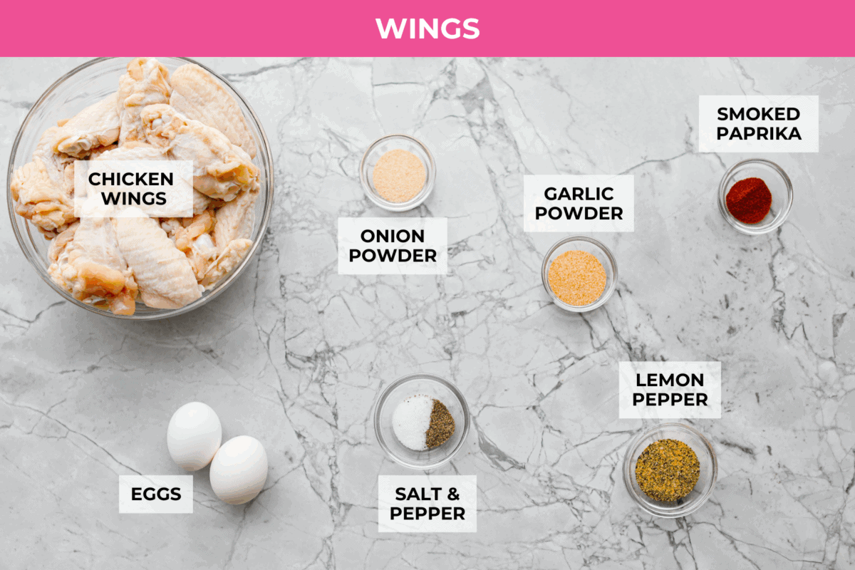 Meet your new wing obsession: Crack Wings. Salty, tangy, peppery, with a touch of sweetness. I've never seen a wing with a powder dusting so full of flavor! They are addictive because of the salty and sweet combo with that hint of heat. Overhead shot of labeled wing and seasoning ingredients.