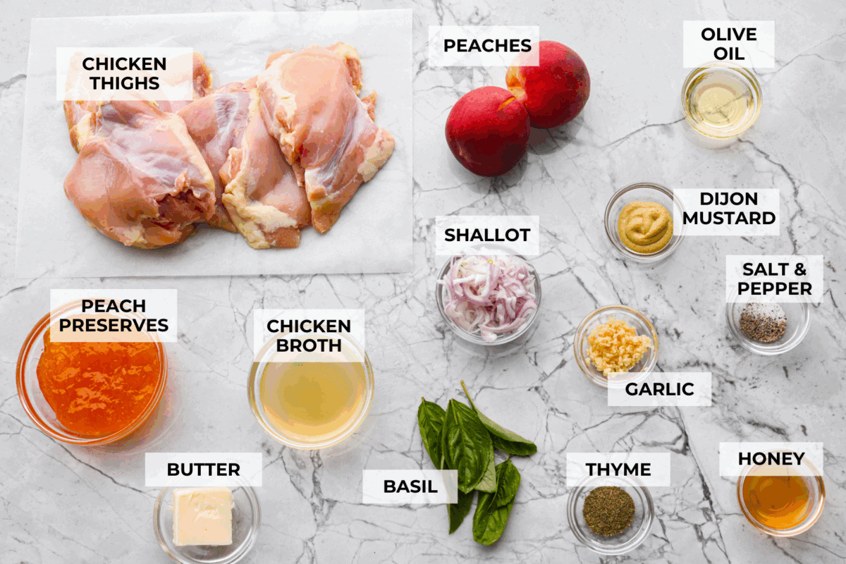 Sweet, savory, and full of summer vibes, peach chicken bakes up juicy and golden in a buttery peach preserve sauce with fresh peaches, Dijon, and a hint of garlic. Finished with basil, it’s simple, elegant, and packed with flavor! Overhead shot of labeled ingredients.