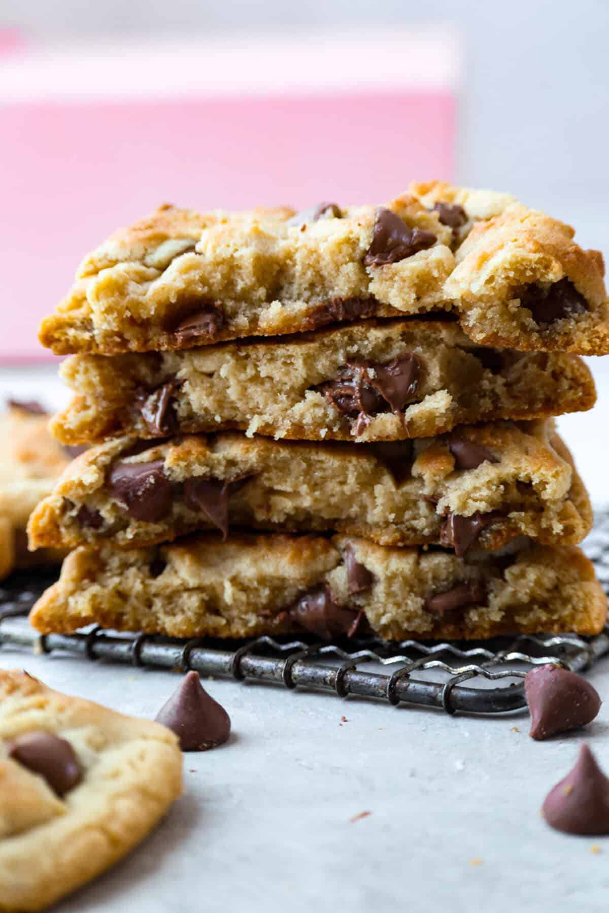 These copycat Crumbl cookies are HUGE, buttery, and loaded with melty chocolate chips. Fresh out of the oven, they just might be even better than the real deal. Bake a batch, do a taste test, and let me know if you like these better! Stack of copycat Crumbl cookies with chocolate chips