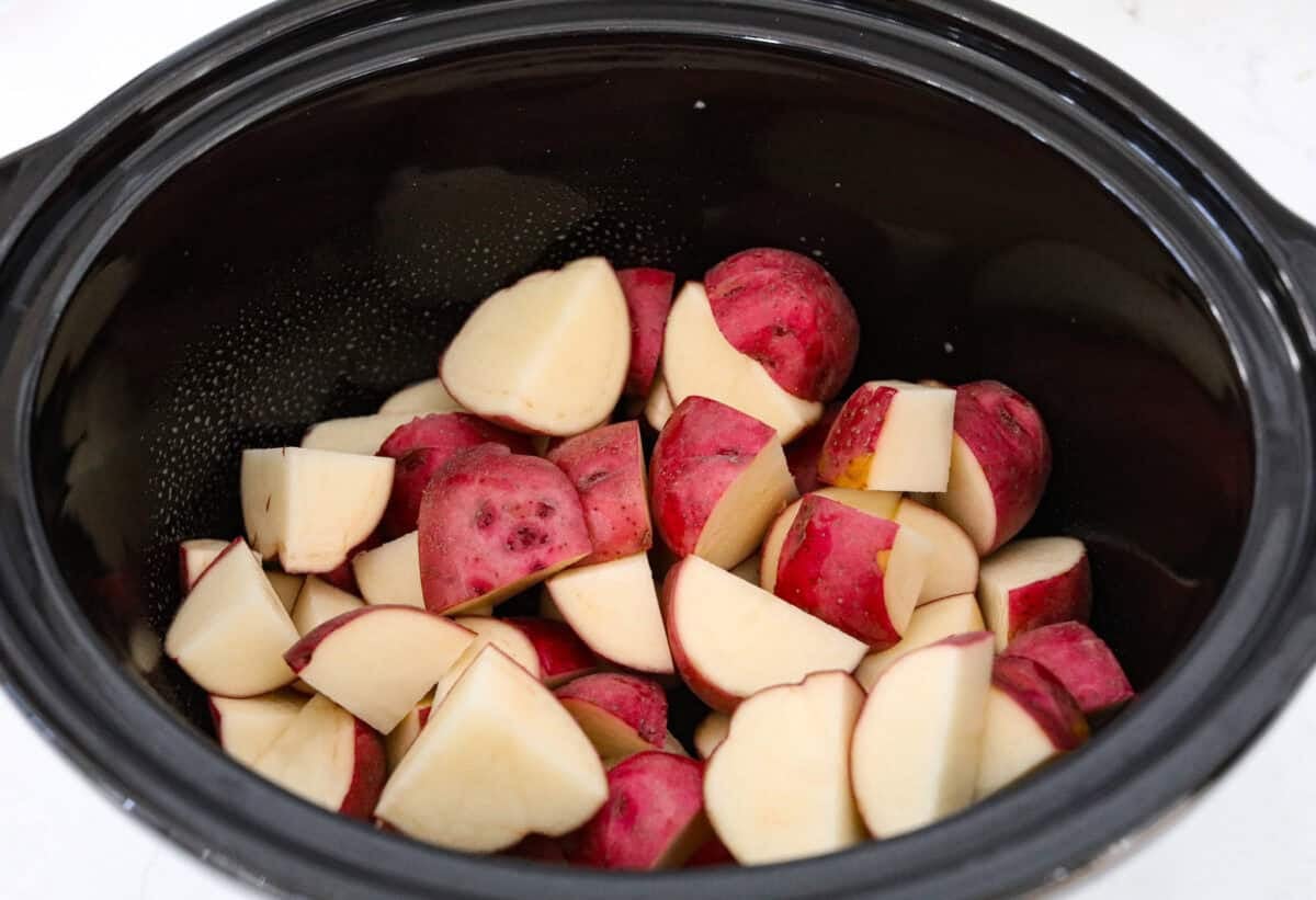 Weeknight magic in one pot! These slow cooker ranch pork chops are rich, comforting, and packed with flavor. With just a few ingredients, you’ll have tender pork and perfectly cooked potatoes swimming in a creamy ranch sauce. Potatoes in the bottom of the crockpot.
