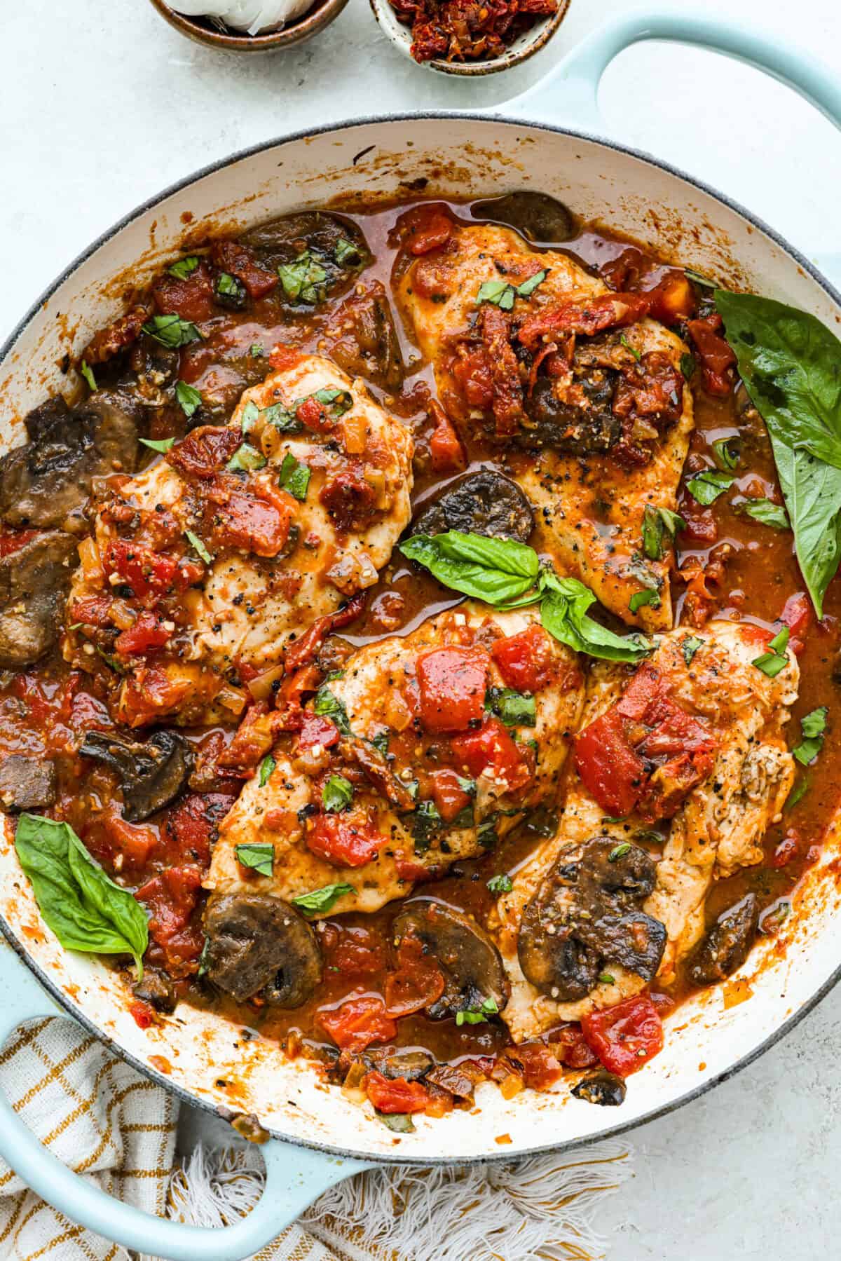 Tuscan garlic skillet chicken is one of those dinners I make and then wonder why I donโt make it more often. Juicy chicken and sun-dried tomatoes all cook together in one skillet. No heavy cream needed. Just fresh, bold flavor in 30 minutes! Tuscan garlic skillet chicken all cooked up in a skillet.