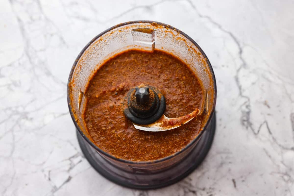 Slow cooker barbacoa beef simmers all day in smoky chipotle, tangy lime, and warm spices until it falls apart. Itโs perfect for tacos, burritos, bowls, or nachos, all with that taquerรญa-style flavor at home. All of the sauce ingredients blended up in a food processor.